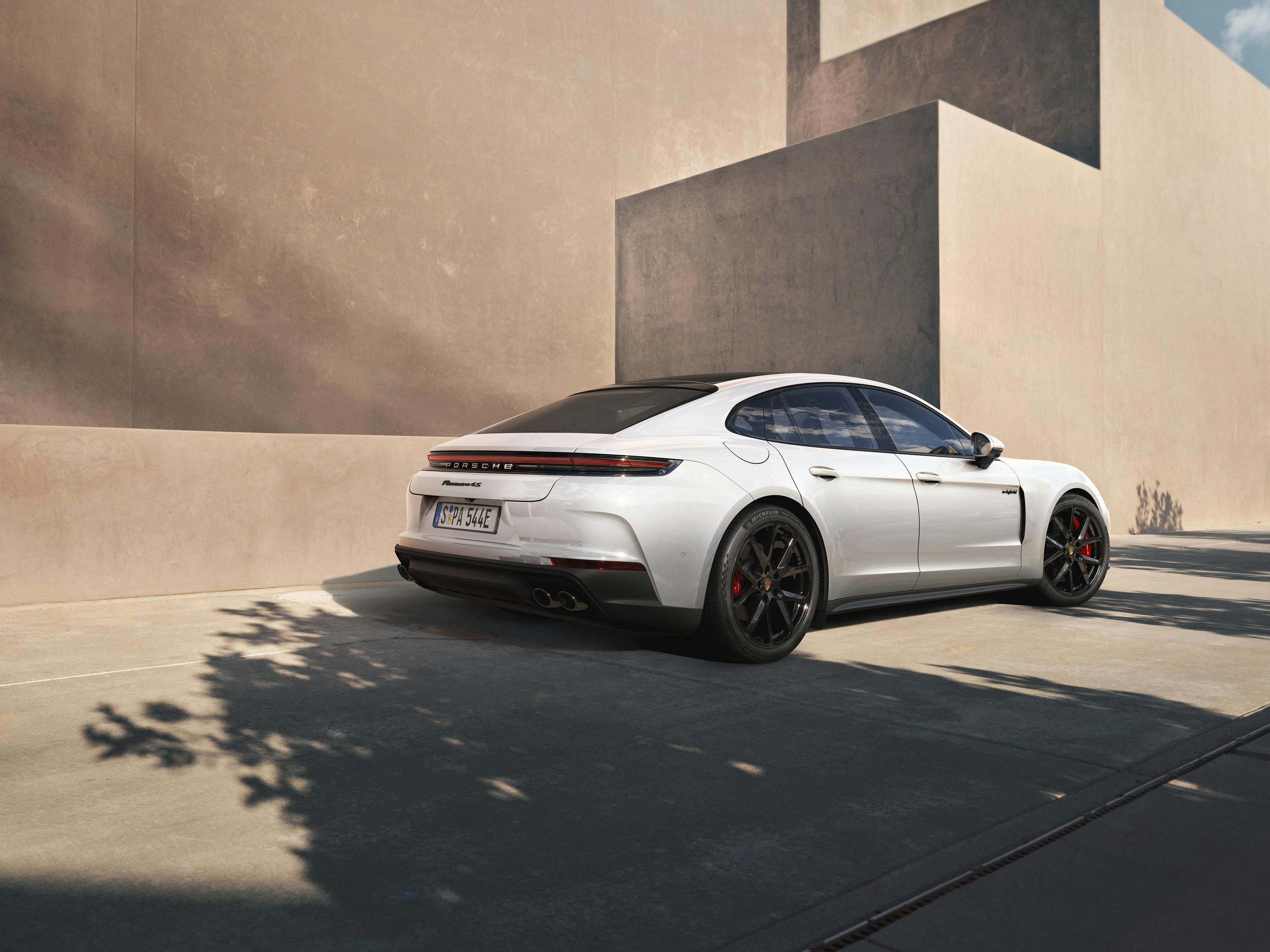 A rear shot of the new Panamera 4S E-Hybrid in a modern building.